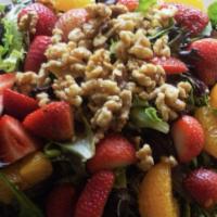 California Salad · Mixed greens, fresh banana, pineapple, strawberries, mandarin oranges, dry cranberries, and ...