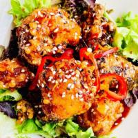 Korean Fried Cauliflower · Twice fried cauliflower, tossed in a sweet and spicy sauce, topped with scallions sesame see...