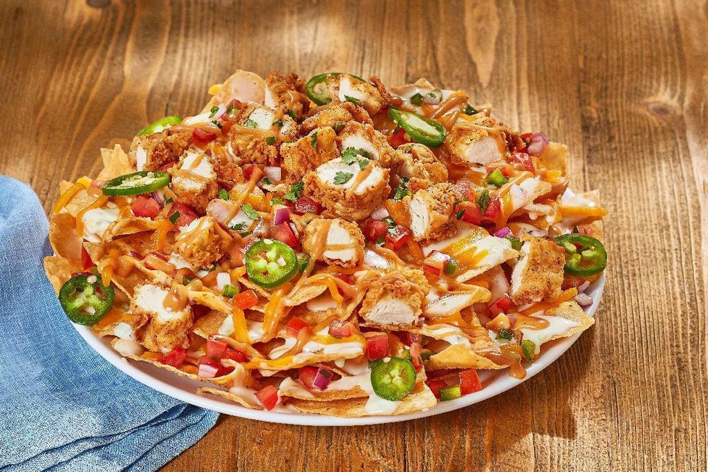Chicken Tender Nachos · O’Charley’s famous chicken tenders, chopped. and on top of warm tortilla chips and queso,. layered with shredded cheddar, Pico de Gallo,. and fresh jalapenos. Drizzled with our special. smokey honey-mustard and topped with. chopped cilantro.