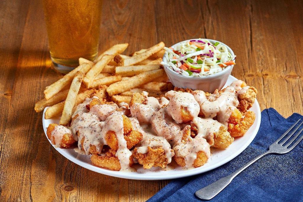 Bayou Tenders & Shrimp · O’Charley’s Famous Chicken Tenders smothered in a Cajun Shrimp sauce and crispy popcorn shrimp, dusted with special Cajun seasonings. Served with choice of two sides.
