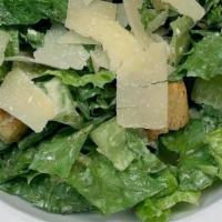 Side Caesar Salad · Caesar dressing, romaine, croutons, and Parmesan cheese.