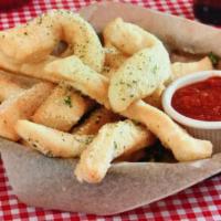 Italian Fries · Strips of our house-made dough lightly fried and tossed in Parmesan cheese. served with mari...