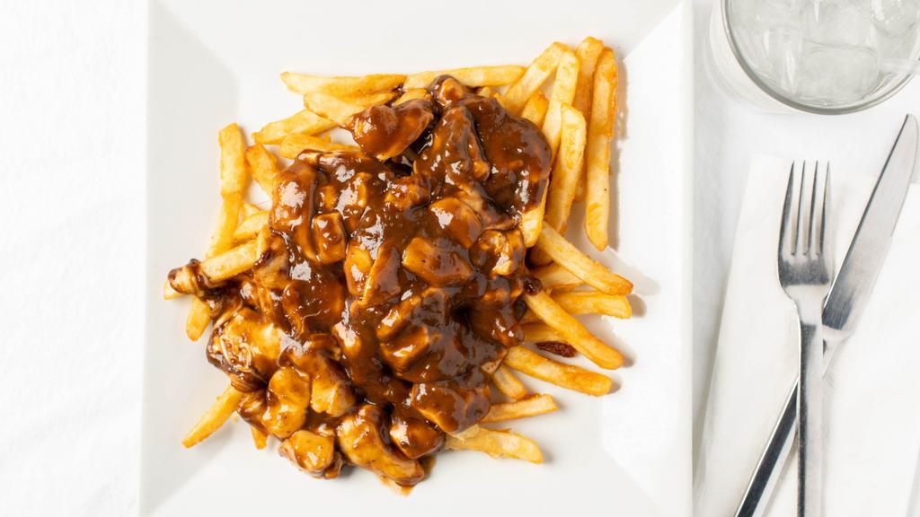Poutine · French fries, melted cheese curds, topped with brown gravy or Irish curry