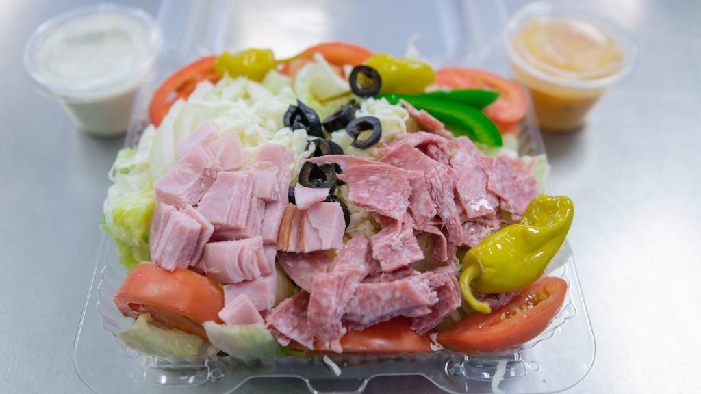 Antipasto Salad · Lettuce, tomatoes, onions, green peppers, black olives, mozzarella, pepperoncini, ham and salami