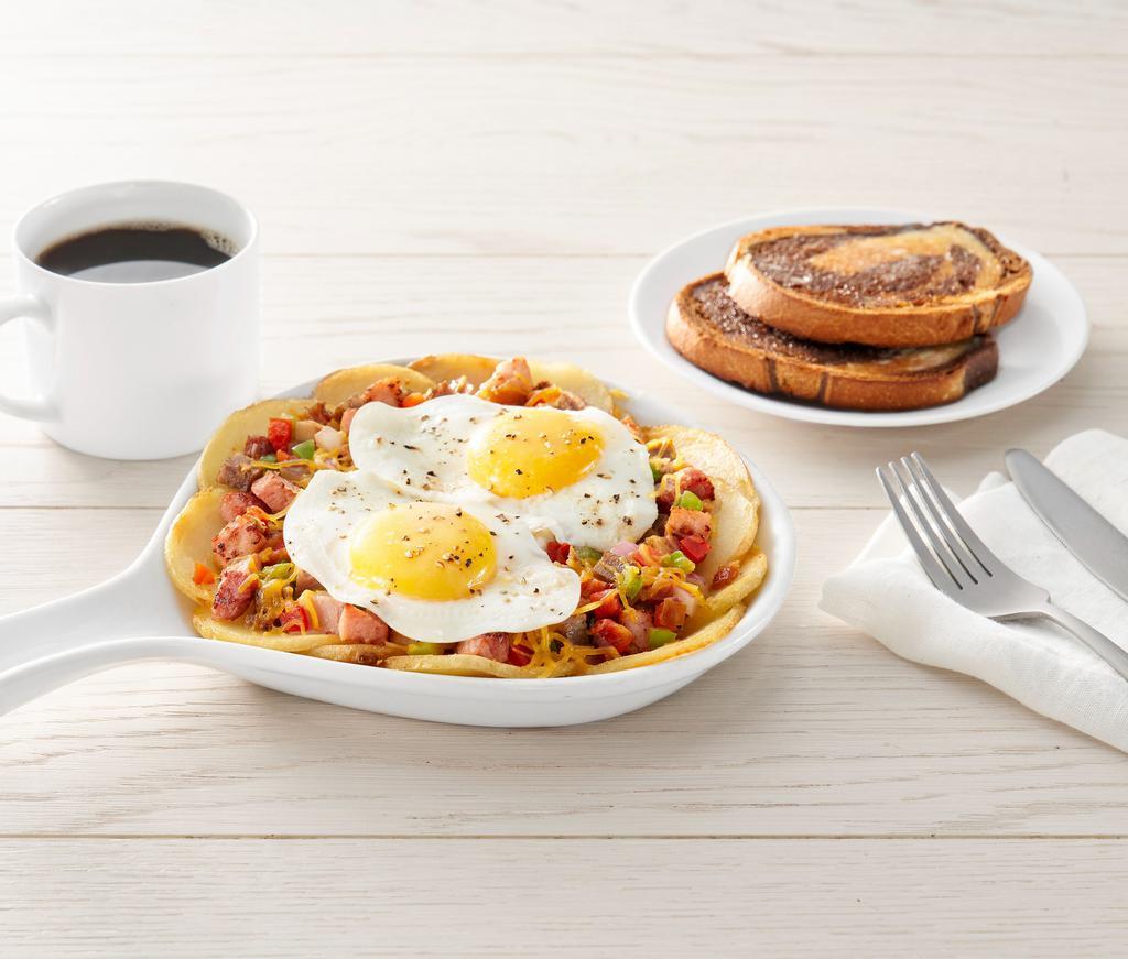 Create Your Own Skillet* · Eggs, choice of up to 3 toppings, all on top of homestyle potatoes. Choice of toast or pancakes (1350-1640 cal)