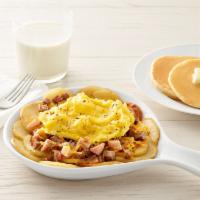 Three Meat Skillet* · Eggs, bacon, sausage, ham and cheddar cheese all on top of homestyle potatoes. Choice of toa...
