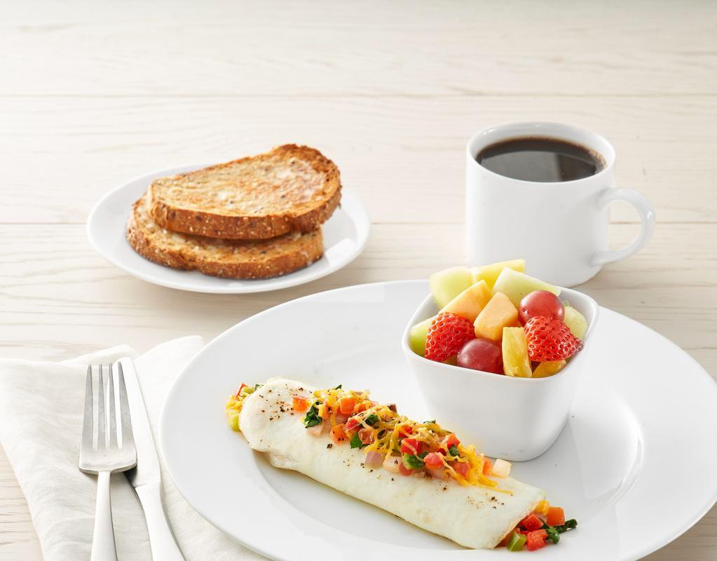 Fit Start Omelet* · Three egg whites, mushrooms, bell peppers, spinach, tomatoes, red onions, and a side of salsa. Choice of side and choice of toast or pancakes (420-1030 cal.)