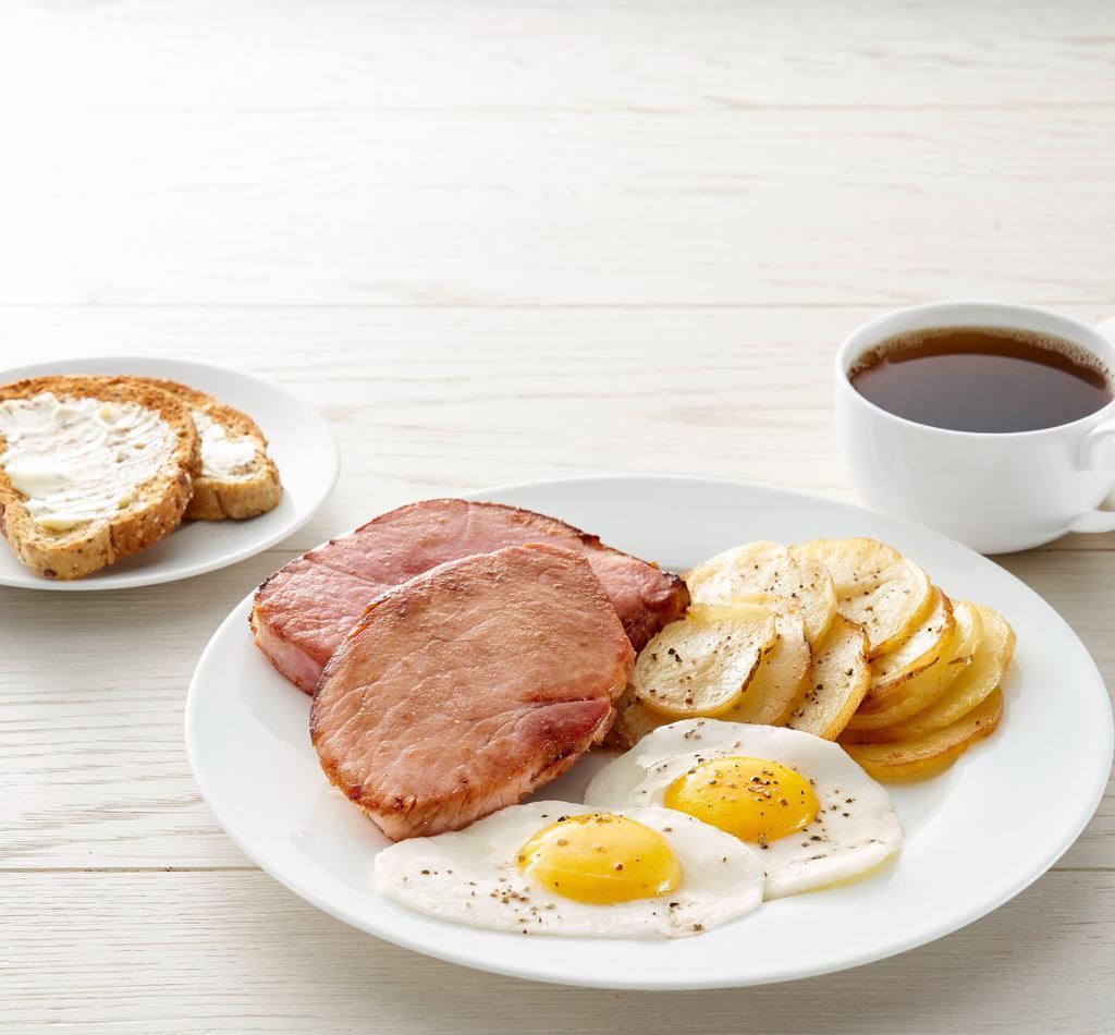Ham Steak And Eggs · two 6 oz. ham steak, eggs*, choice of side, and choice of toast or pancakes (1150-1750 cal)