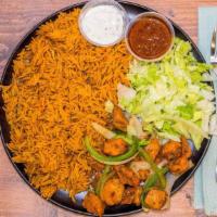 Grilled Chicken (Suqaar) With Somali Rice · Chopped cubed chicken grilled with onions, green peppers served with rice
