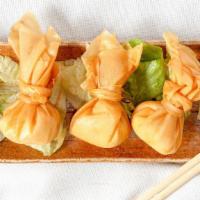 Crab Rangoon · 4 pcs. Handmade crab pouches. Served with sweet chili dipping sauce.