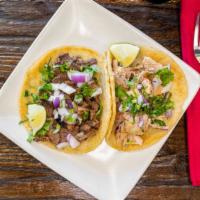 Taco · Comes with cilantro, onion, a choice of salsa and protein, wrapped up in a house made corn t...