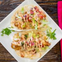 Fish Or Shrimp Taco · Battered Fish or Shrimp on a flour tortilla topped with Chipotle Aioli and Apple Pico