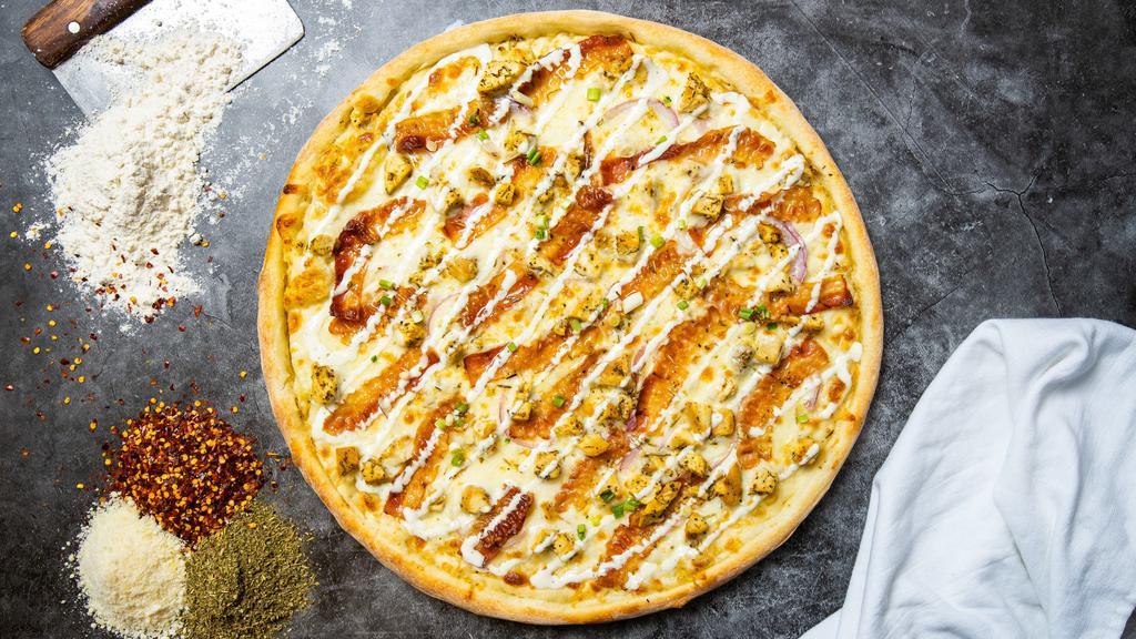The Chicken Ranch Chase Pizza · Ranch drizzle, juicy chicken, mozzarella, marinara, and baked on a hand-tossed dough.