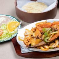 Fajitas De Pollo · Served with rice and beans.