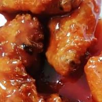 Thai Chicken Wings · 7 pieces. Golden fried chicken wings mix in thai sweet and sour sauce.