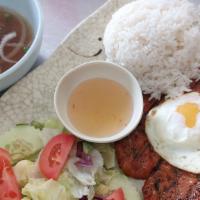 Pork Chop · Vietnamese grilled pork chop with egg sunny side up with white rice and salad.