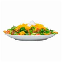 Chili Salad · Mixed greens topped with chili, cheddar cheese, sour cream, tomatoes, and Fritos® corn chips...
