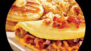 Meat Lover'S · three farm-fresh eggs, bacon, sausage, ham, and cheddar (served with hash browns or fresh fr...