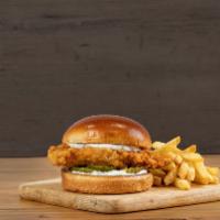 Dolly Chicken Sandwich · hand-breaded and fried chicken breast and pickle chips on a grilled brioche bun with tartar ...