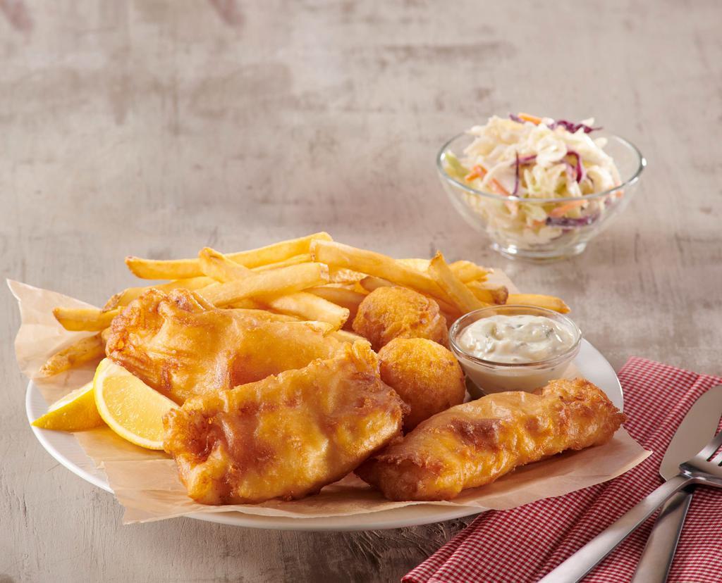 Fish & Chips · premium cod fillets hand-battered to order, served with fries, hush puppies, coleslaw and tartar sauce.
