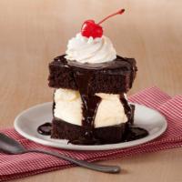 Hot Fudge Ice Cream Cake · Our classic chocolate hot fudge cake, stacked with vanilla ice cream, then topped with Big B...