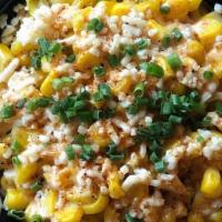 Mexican Corn · Seasoned corn off of the cob topped with a spicy lime aioli, cotija cheese, spicy rub and ga...