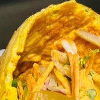 Frankie · Wrap w/egg omelet layering served with choice of protein, cilantro, onions, cucumber slaw & ...