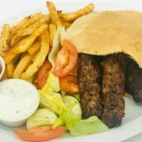 Shami Kabob Sandwich · Beef kabob inside our handmade pita bread with fresh lettuce, tomatoes, cucumbers, and fries...