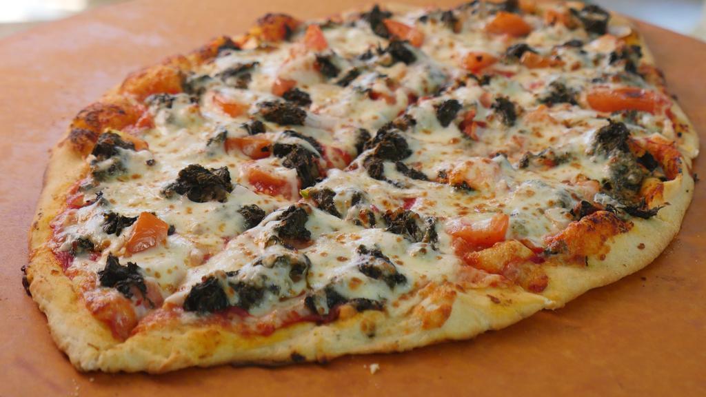 Spinach Lovers Pizza (Xl 24') · Vegetarian. Includes spinach, garlic, tomatoes, and onions. Sixteen slices.