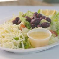 Italian Salad · Freshly cut romaine lettuce, cucumbers, tomatoes, and black olives topped with mozzarella ch...