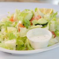 House Salad · Freshly cut romaine lettuce, cucumbers, tomatoes, and cucumber sauce.