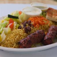 Shami Kabob Plate · Beef kabob with rice, salad, raisins, carrots, and bread.