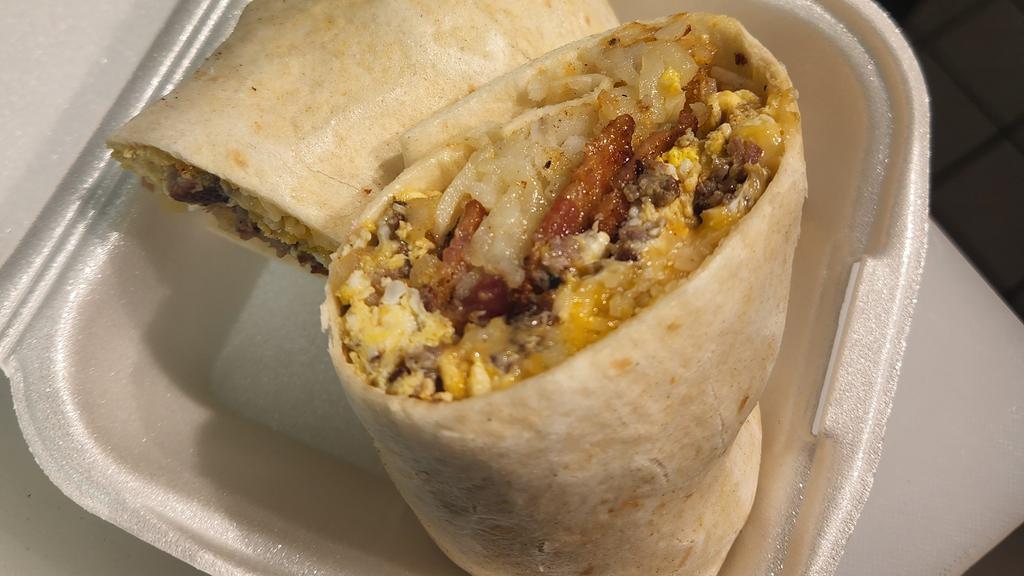 Porkrito · Shredded cheese, hash brown, two eggs, 2 bacon and sausage, wrapped in a tortilla and served with a side of cheese sauce
