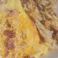 Ham & Cheese Omelet · Diced ham, and shredded cheese loaded inside of 2 eggs.