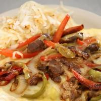 Philly Chick · Shredded beef, bell peppers, onions, and provolone cheese folded in three eggs.