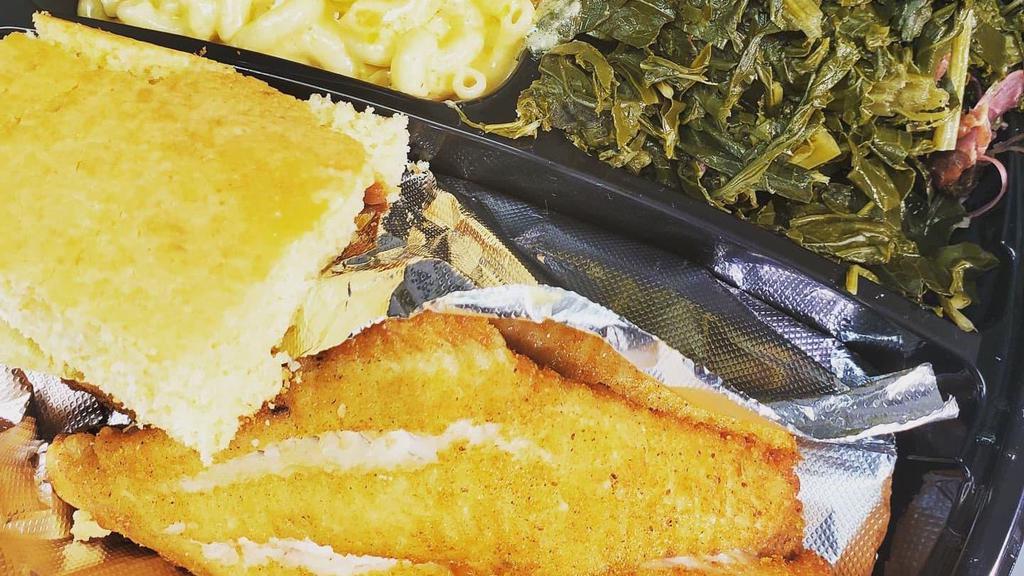 Catfish Dinner · 2 pc fried catfish served with mixed greens w/ turkey, mac/cheese and cornbread.