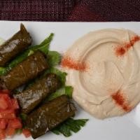 Stuffed Grape Leaves · Grape leaves stuffed with meat, rice, parsley, onions & special seasoning. Served with pita.