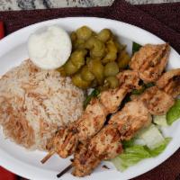 Shish Tawook · Two Shish tawook (cubed & marinated chicken breast) skewers, charbroiled & served with rice,...