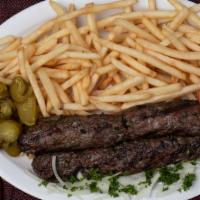 Shish Kafta · Two Shish kafta (seasoned ground beef mixed with onions & parsley) charbroiled & served with...