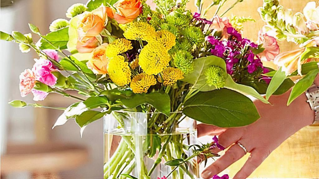 Bold & Bright Florist Original · Give someone special a beautiful bouquet that pops with color! The Bold & Bright arrangement features beaming blooms to express everything from “good luck” to “you’re the best.” Vase included. Please Note: The colors or floral varieties used in this bouquet will vary based on freshness and availability. A local florist will expertly craft a one of a kind arrangement using the finest quality flowers. The actual design you or your recipient will receive will be different from the image shown here. Item # B-6022