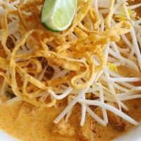 Lanna Noodles · Egg Noodles in a curry sauce topped with bean sprouts, crispy noodles, white onions, sour mu...