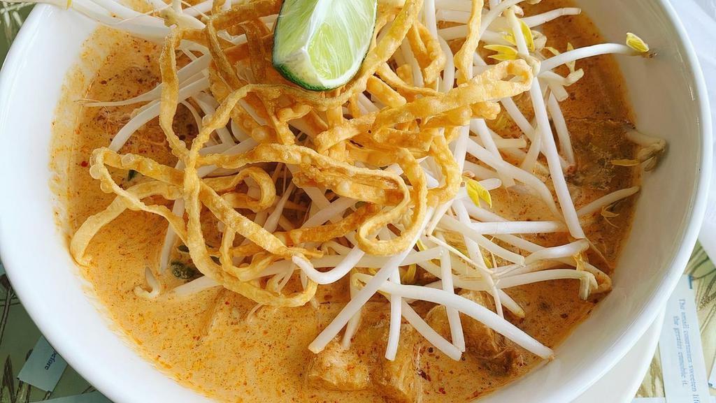Lanna Noodles · Egg Noodles in a curry sauce topped with bean sprouts, crispy noodles, white onions, sour mustard greens and lime.