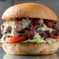 Blue · Bacon, creamy blue cheese, lettuce, tomato, and house burger sauce.