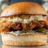 Hot Chicken · Hot fried chicken, house coleslaw, house pickles, and mayo on a brioche bun.