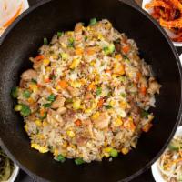 춘천닭갈비 / Spicy Stir-Fried Chicken · Chicken pieces marinated in a gochujang, and stir fried in a flat grill pan with cabbage, sw...