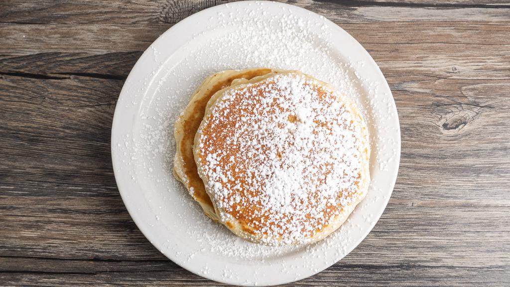 Classic Buttermilk Pancakes · Dusted with powdered sugar and served with warm syrup.
