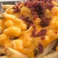 Bacon Mac Fries · French fries topped with macaroni and cheese, bacon bits and scallions.