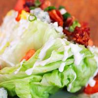Wedge Salad  · Iceberg  lettuce, bleu cheese crumbles, smoked bacon,  green onions, tomatoes, bleu cheese, ...