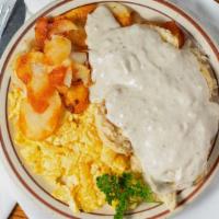 The Barnyard Buster® · Two biscuits, two eggs, country fries, all on one plate covered with country sausage gravy.
...