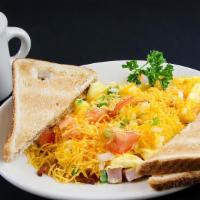 J. Scramble · Crispy hash browns topped with a mixture of scrambled eggs, tomatoes, green peppers, onions,...